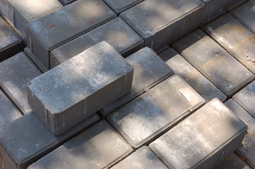 stack of stoneblocks (bricks) of grey surface for pavement