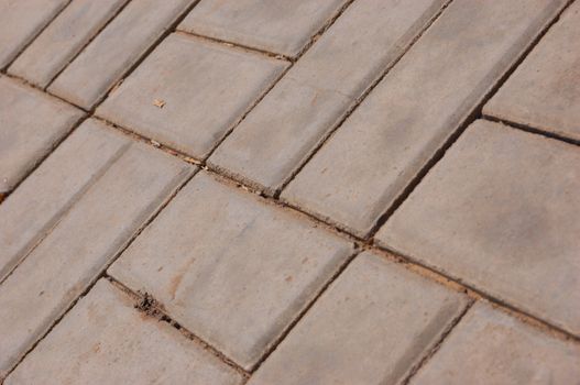 close-up new pavement of stoneblocks (bricks) of grey color