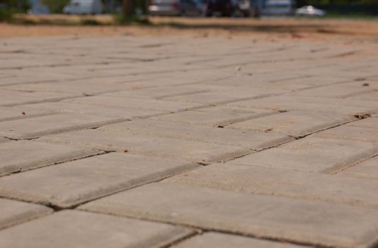 new pavement of stoneblocks (bricks) of grey color