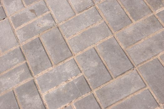 close-up of new pavement of stoneblocks (bricks) of grey color