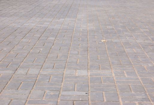 new pavement of stoneblocks (bricks) of grey color