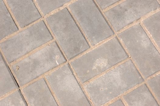 close-up of new pavement of stoneblocks (bricks) of grey color