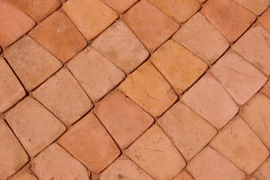 close-up of new pavement of stoneblocks (bricks) of warm color
