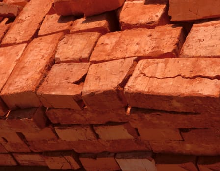 stack of baked bricks with red surface