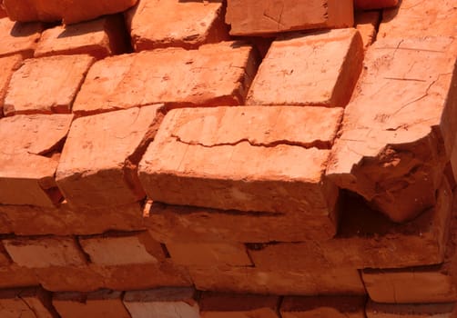 stack of baked bricks with red surface