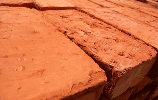 close-up of baked bricks with red surface