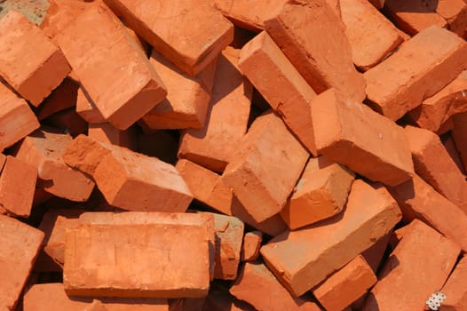 heap of baked bricks with red surface