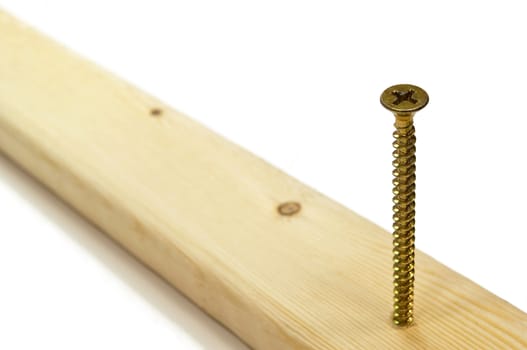 High resolution photo of a phillips screw in wood.