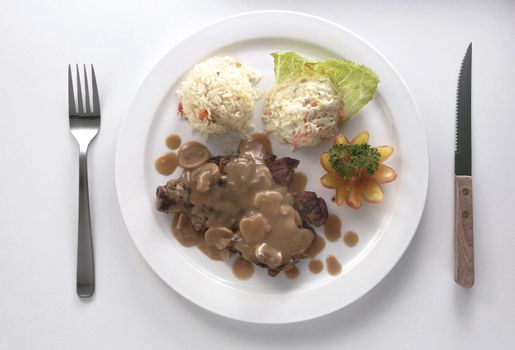 steak on the plate with fork and knife