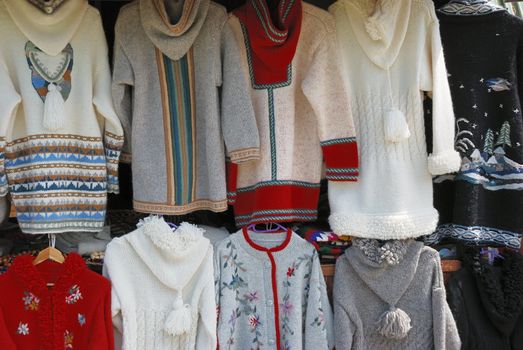 Colorful woolen handmade sweaters on sale.