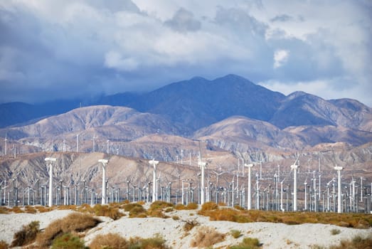 Windmills rotating and producing clean energy, electric power.