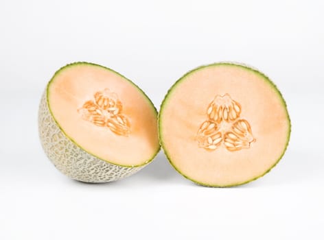 Halved cantelope isolated on a white background