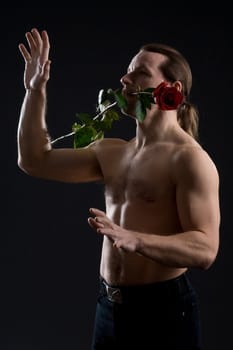 clambering romantic man with red rose
