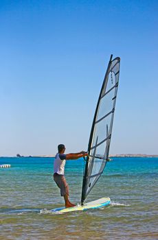 Egypt. Fast moving windsurfing on the background of the sea.