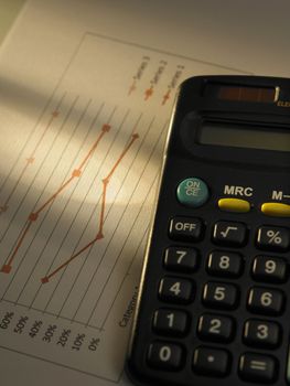 chart and calculator on the table