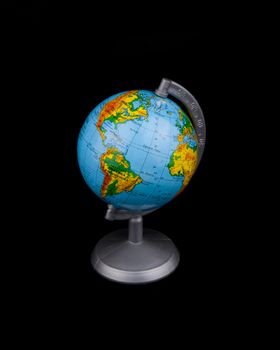 Small globe on black background