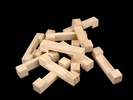 Wooden puzzle on black background