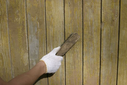 Cleaning a wood wall.