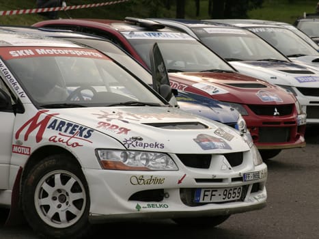Rally cars parked in a row.