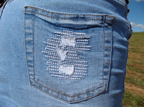 Jeans skirt pocket`s extreme close- up.