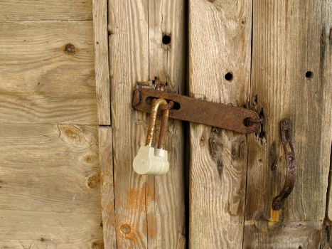 Lock on old wood door.