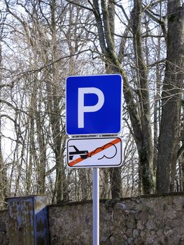 A Parking sign in a park. Stop engine!