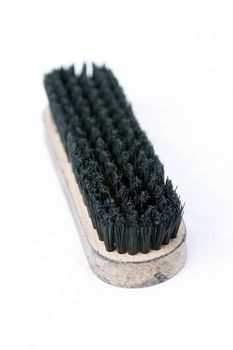 A brush used for shoeshining isolated on white background