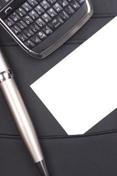 Businesscard and phone on a black leather folder
