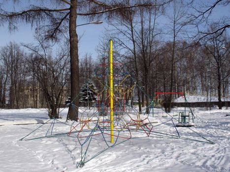 Family playground`s element on winter.