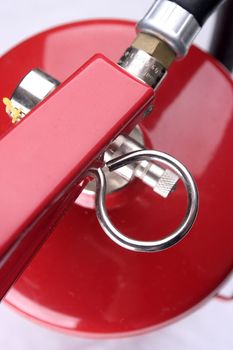 Closeup of a red fire extinguisher. 