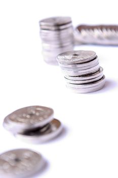 Coins spread out; isolated on white background