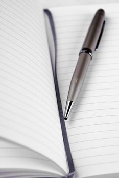 Pen and notebook used on a businessmeeting