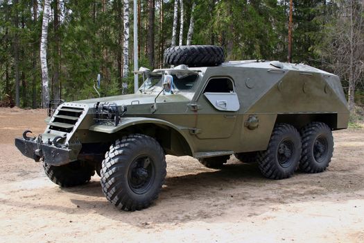 The russian 3 axes armored car at the sand.
