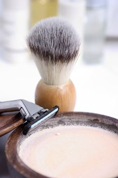 Shaving brush and accessories in the background