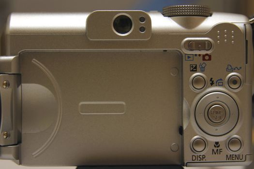 Back of a digital compact photo camera.