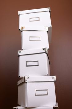 White boxes for storing things on a brown background