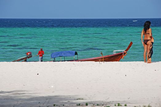 Female model wearing a bikini on a tropical beach