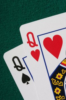 Close up of pocket QQ - a very strong hand in texas holdem poker