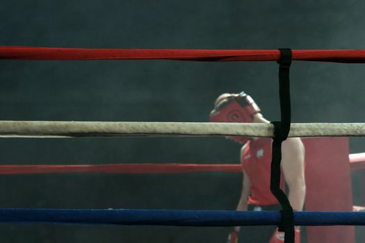Defeated boxer hangs his head after the fight