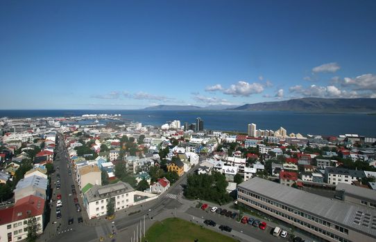 Aerial view of Reykjavik city overlooking the harbor and Mt. Esja