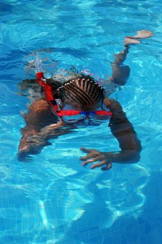 Young girl snorkeling on summer vacation