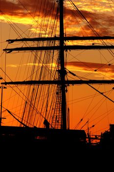 Silhouette of a schooner against the sunset