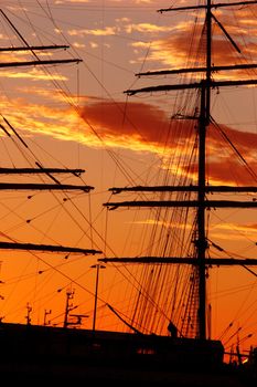 Silhouette of a old schooner against the sunset