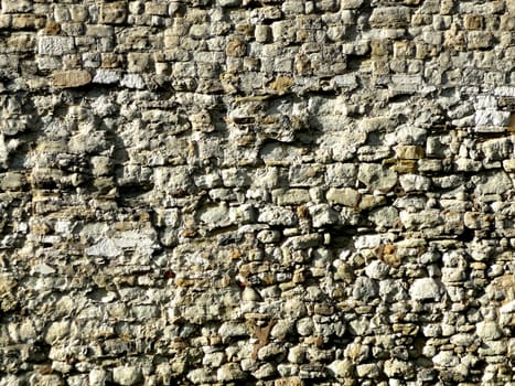 A view of a wall of stones that make up the tower of London in London. It would make a good texture background.