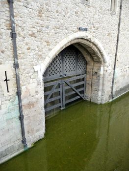 A view of traitors gate which is one of the many gates into the Tower of London. The water in the scene is from the River Thames.