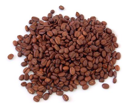 macro of heap of coffee beans against white