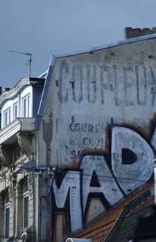 Building on the Grand Place, Lille, France displaying graffiti.
