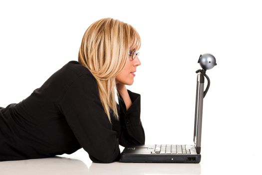 A businesswoman using laptop and webcam