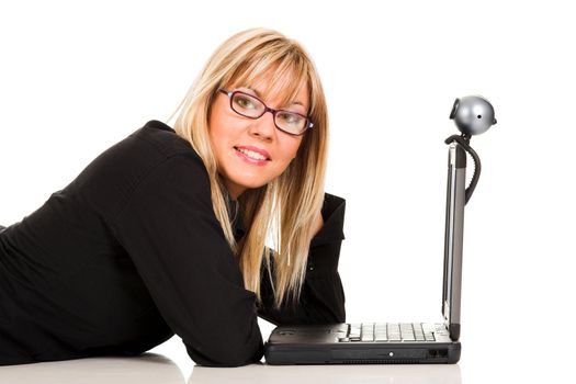 A businesswoman using laptop and webcam