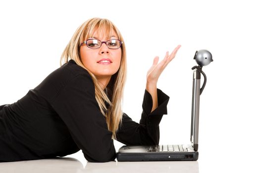 A businesswoman using laptop and webcam